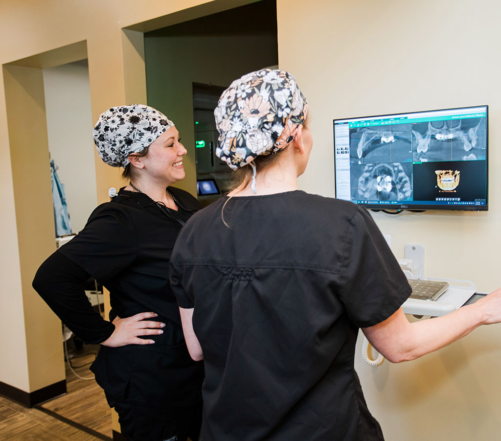 Hamburg Family Dentists viewing a dental X-ray